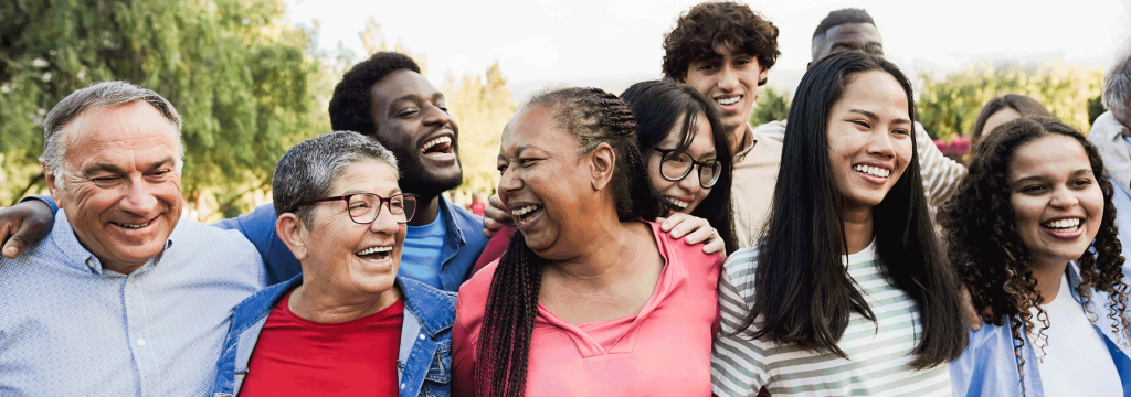 A diverse group of happy people of a wide range of ages.